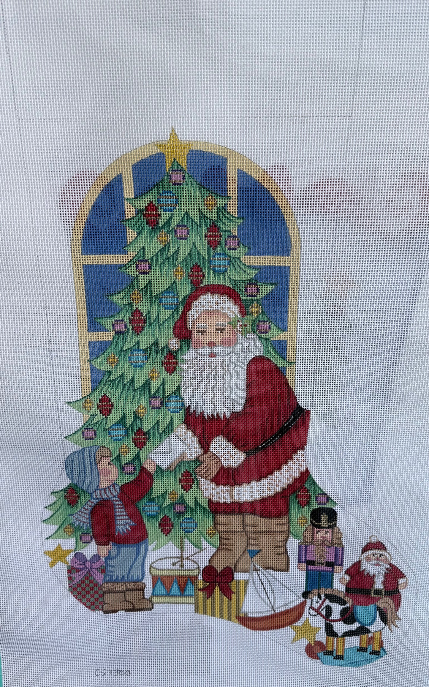 Stocking with Santa and Young Boy by Christmas Tree