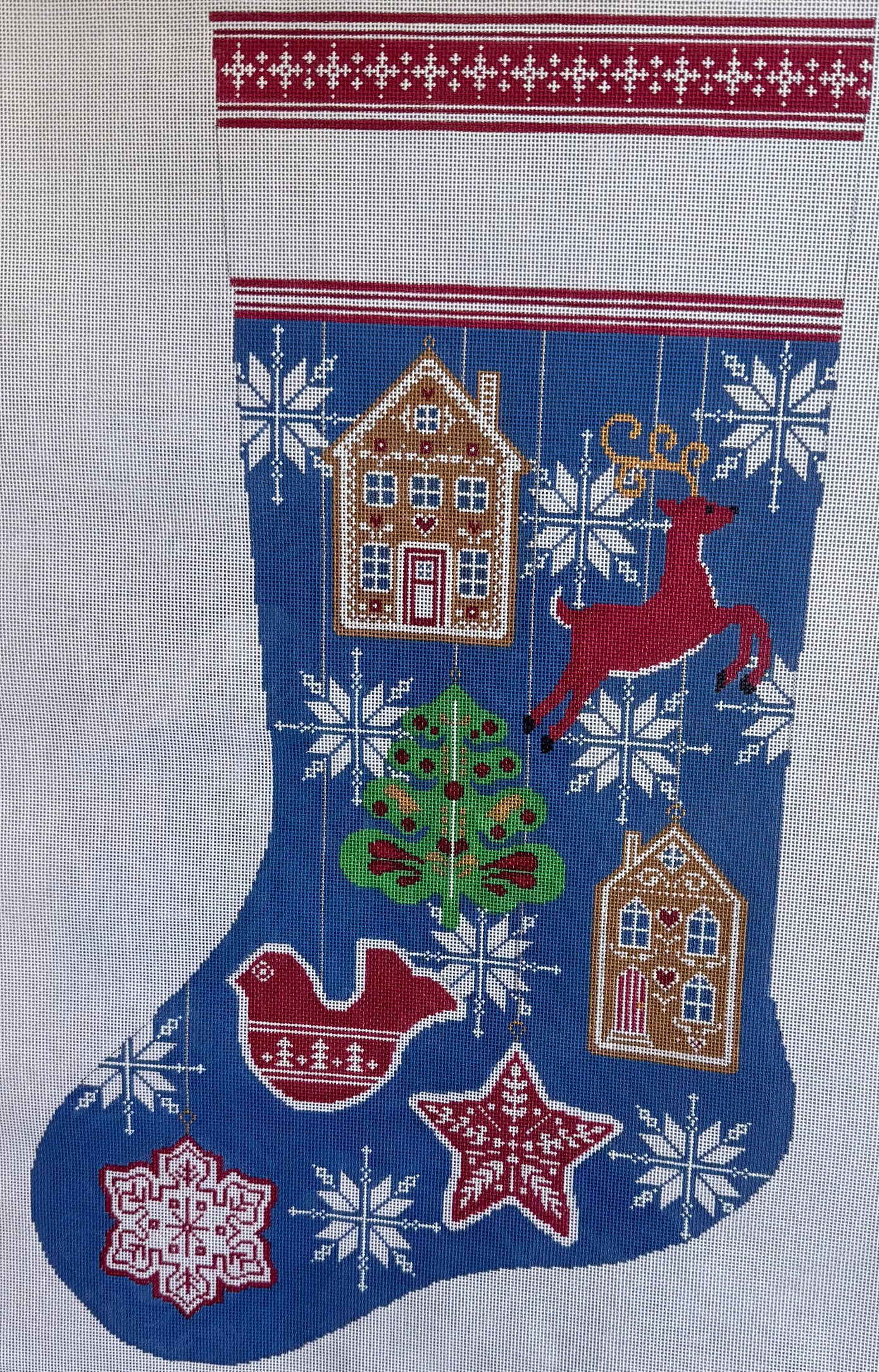 Blue Stocking with Christmas Ornaments and Tree