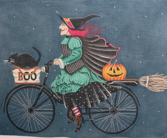 Witch on a Bike with Black Cat