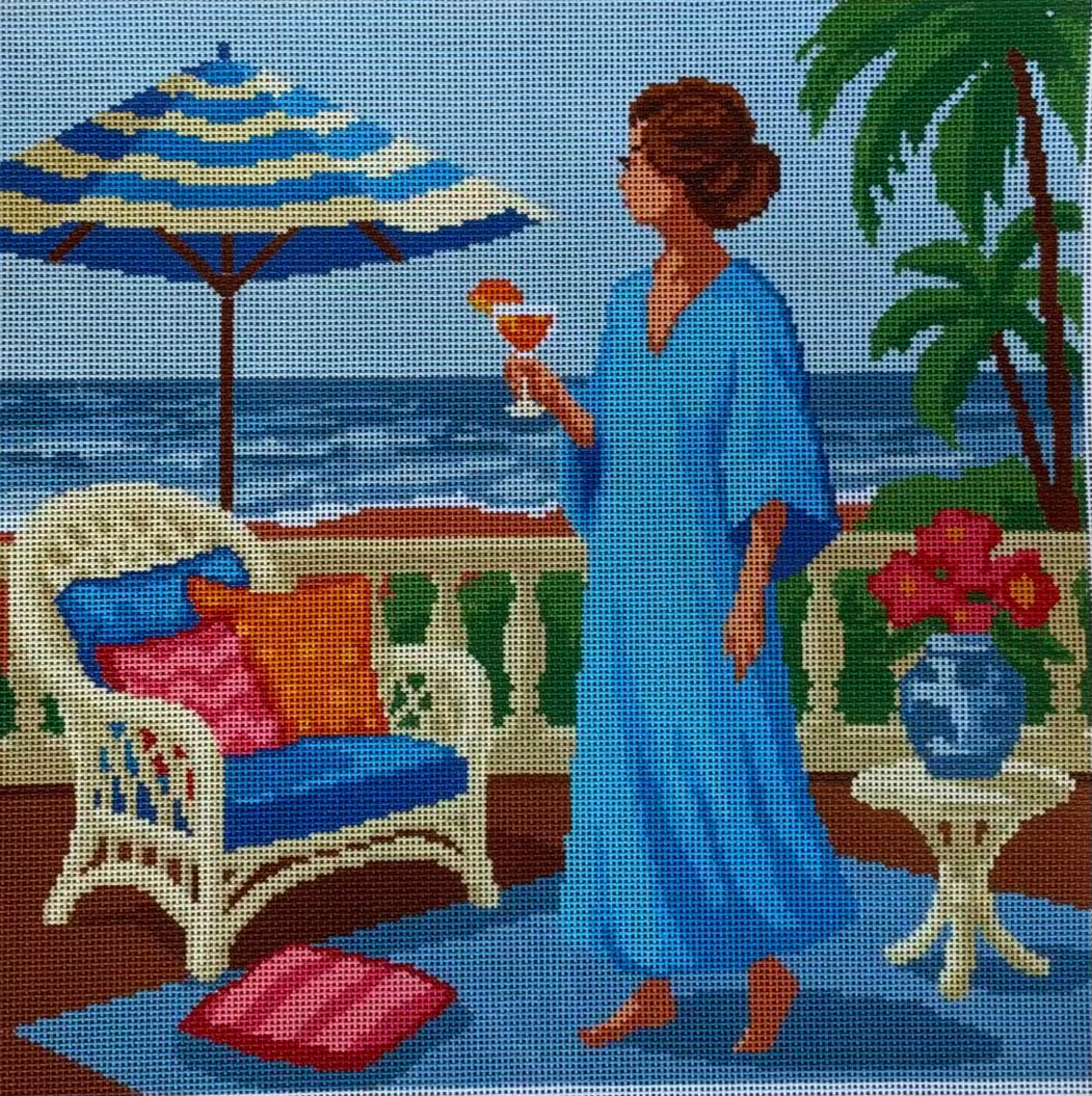 Woman in Blue Caftan Above Ocean with Aperol Spritz
