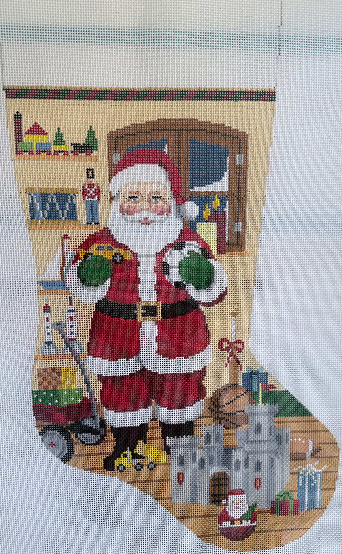 Santa Stocking with Toys and Castle by Snowy Window
